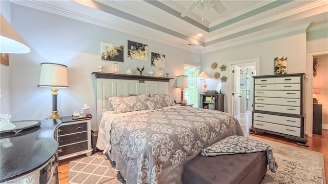 1250 Whitworth Ct, Kernersville, NC 27284 - bedroom with wood finished floors, ornamental molding, ceiling fan, and a raised ceiling