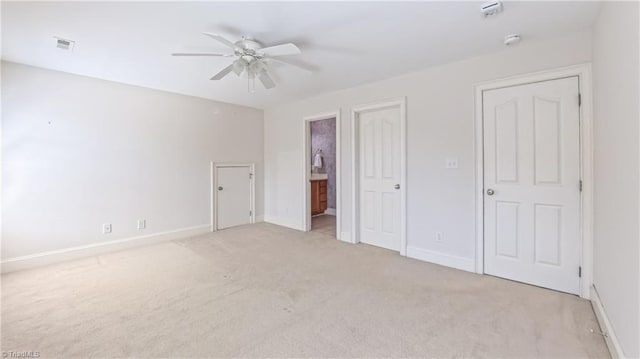 1250 Whitworth Ct, Kernersville, NC 27284 - unfurnished bedroom featuring light colored carpet, ensuite bath, and a ceiling fan