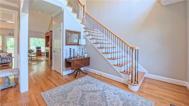 1250 Whitworth Ct, Kernersville, NC 27284 - stairs with ornamental molding and wood finished floors