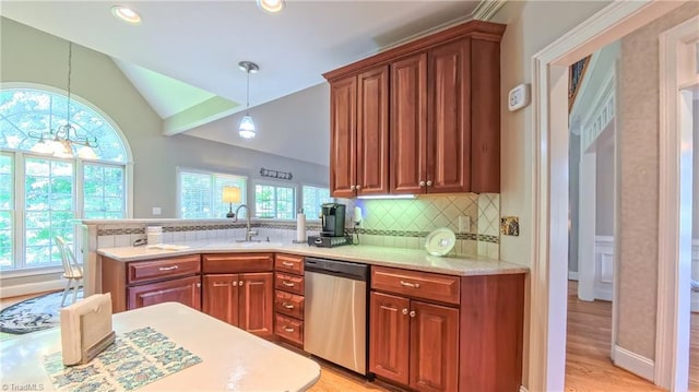 1250 Whitworth Ct, Kernersville, NC 27284 - kitchen featuring stainless steel dishwasher, a peninsula, backsplash, vaulted ceiling, and light wood-type flooring