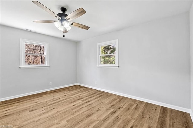 spare room featuring light hardwood / wood-style floors and ceiling fan