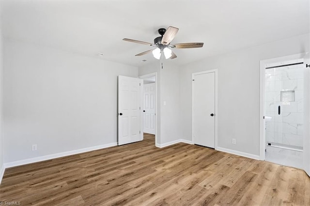 spare room with ceiling fan and light wood-type flooring