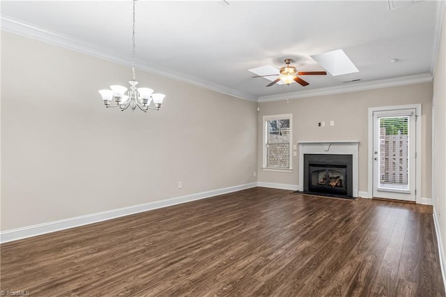 5707 Washburn Ln, Colfax, NC 27235 - unfurnished living room with dark wood-style flooring, ornamental molding, a fireplace with flush hearth, baseboards, and a skylight
