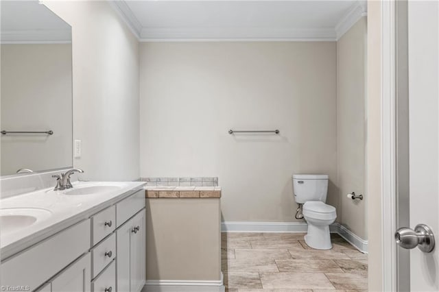 5707 Washburn Ln, Colfax, NC 27235 - full bath with ornamental molding, toilet, double vanity, and baseboards