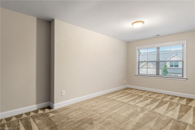 5707 Washburn Ln, Colfax, NC 27235 - carpeted spare room featuring baseboards
