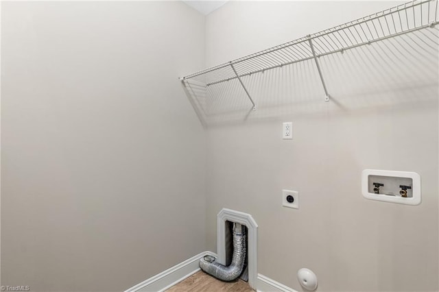 5707 Washburn Ln, Colfax, NC 27235 - laundry room featuring washer hookup, baseboards, hookup for an electric dryer, gas dryer hookup, and light wood-style floors