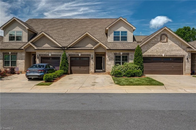 5707 Washburn Ln, Colfax, NC 27235 - view of front of property with concrete driveway, brick siding, roof with shingles, and a garage