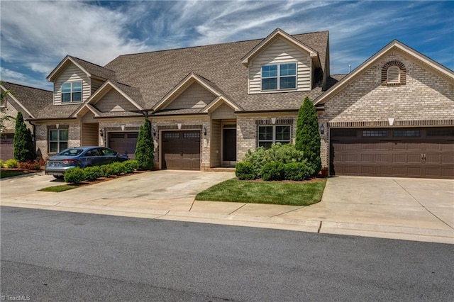 5707 Washburn Ln, Colfax, NC 27235 - view of front of property featuring driveway, brick siding, a shingled roof, and an attached garage