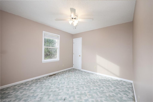 unfurnished room with carpet, a textured ceiling, and ceiling fan