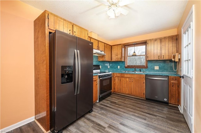 kitchen featuring dark hardwood / wood-style floors, tasteful backsplash, and stainless steel appliances