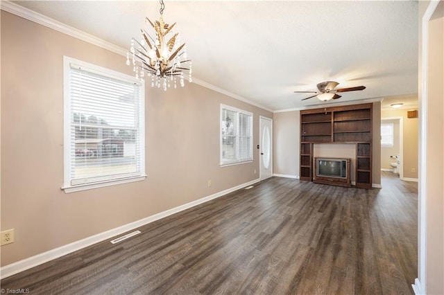 unfurnished living room featuring crown molding, dark hardwood / wood-style floors, and a healthy amount of sunlight