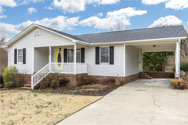 single story home featuring covered porch and a carport