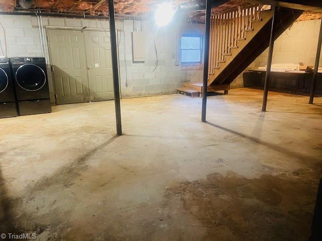 basement with washer and clothes dryer