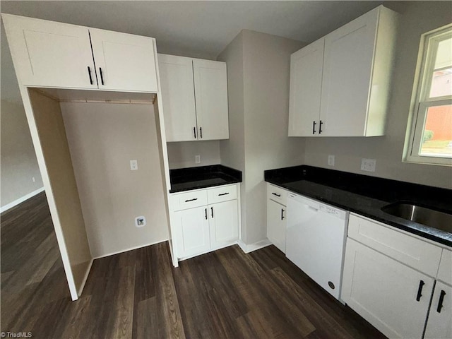 kitchen featuring white cabinets, dark hardwood / wood-style floors, white dishwasher, and sink