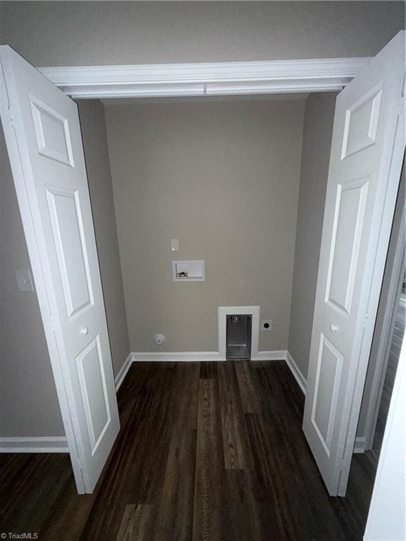 clothes washing area featuring dark hardwood / wood-style floors, hookup for a washing machine, and hookup for an electric dryer