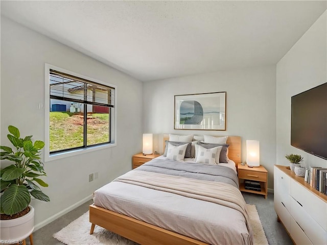 bedroom with carpet flooring and baseboards