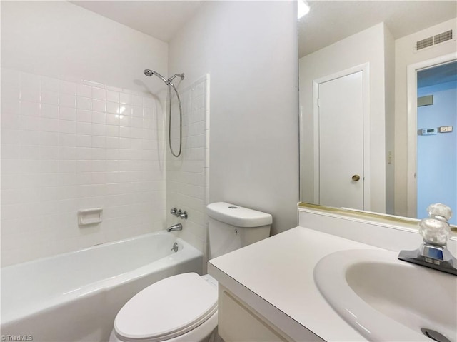 full bathroom featuring toilet, tub / shower combination, and vanity