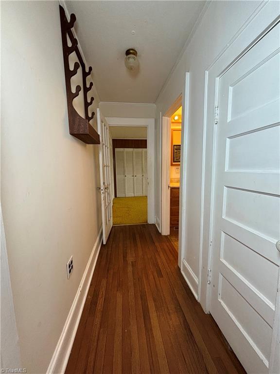 hallway featuring dark hardwood / wood-style floors