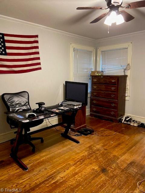 office featuring crown molding, hardwood / wood-style floors, and ceiling fan