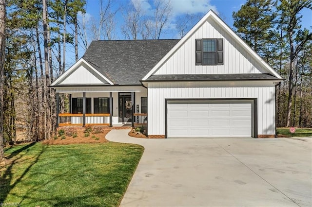 modern farmhouse style home with a front yard, driveway, roof with shingles, a porch, and a garage