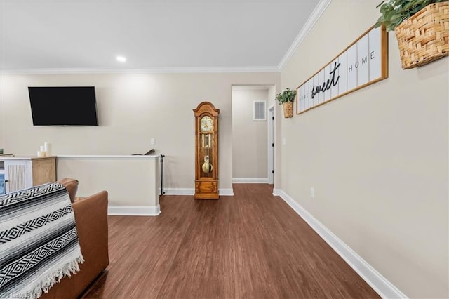 interior space featuring recessed lighting, crown molding, baseboards, and wood finished floors