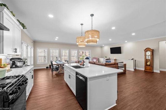 kitchen with a sink, black appliances, dark wood-style flooring, and light countertops