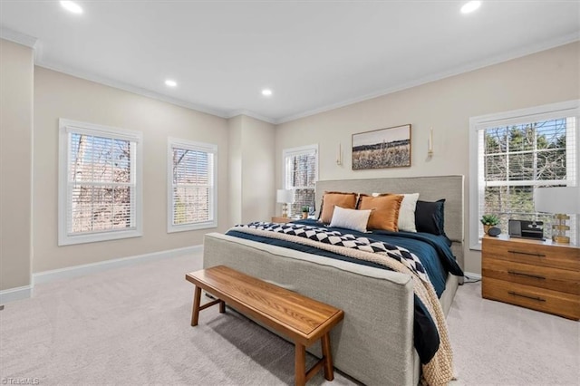 carpeted bedroom featuring multiple windows, baseboards, and ornamental molding