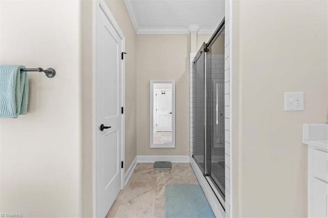 bathroom with a shower stall, baseboards, ornamental molding, marble finish floor, and vanity