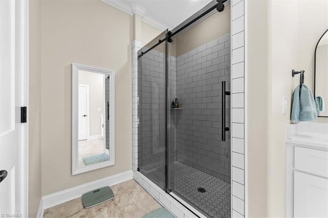 bathroom featuring vanity, a shower stall, baseboards, and ornamental molding