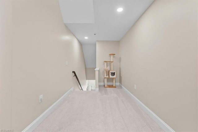 corridor featuring recessed lighting, baseboards, an upstairs landing, and carpet floors