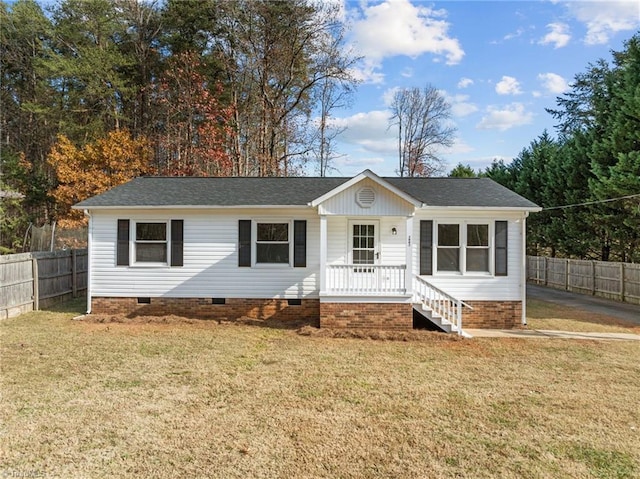 ranch-style home featuring a porch and a front yard