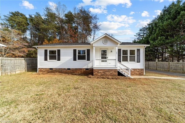 view of front of home featuring a front lawn and covered porch