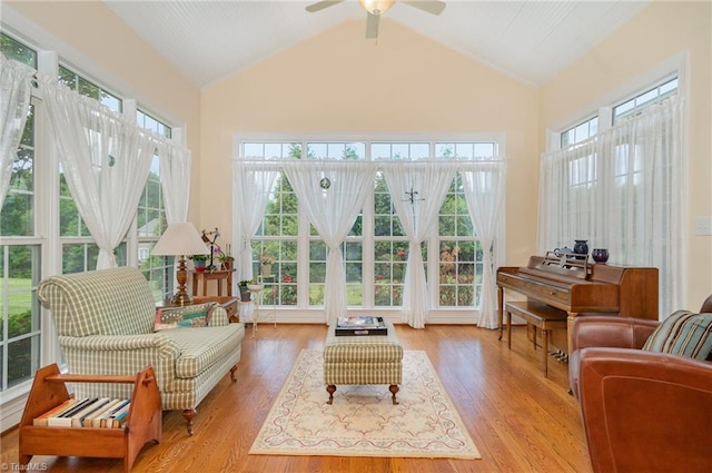 7469 Henson Forest Dr, Summerfield, NC 27358 - sunroom / solarium with healthy amount of natural light, wood finished floors, and high vaulted ceiling