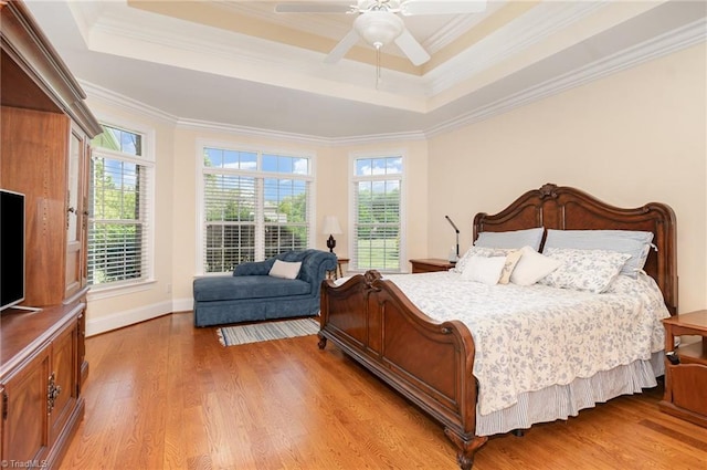 7469 Henson Forest Dr, Summerfield, NC 27358 - bedroom with a raised ceiling, wood finished floors, ornamental molding, baseboards, and a ceiling fan