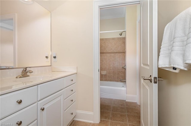 7469 Henson Forest Dr, Summerfield, NC 27358 - full bathroom with tile patterned floors, vanity, baseboards, and shower / bath combination