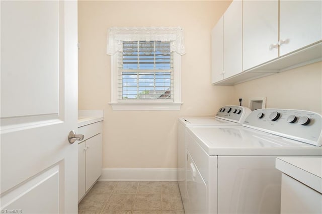 7469 Henson Forest Dr, Summerfield, NC 27358 - laundry room featuring cabinet space, washing machine and dryer, baseboards, and light tile patterned floors