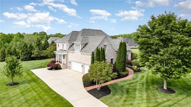 7469 Henson Forest Dr, Summerfield, NC 27358 - view of side of home featuring stone siding, concrete driveway, an attached garage, and a lawn
