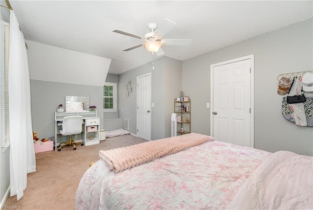 bedroom with ceiling fan, visible vents, light carpet, and baseboards