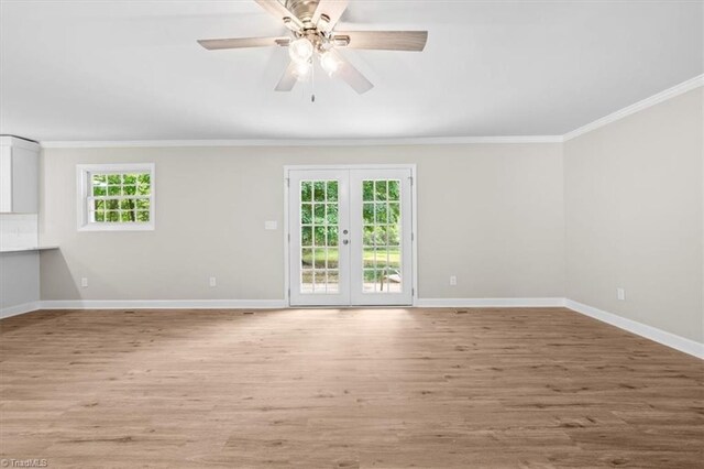 2517 Hopewell Friends Rd, Asheboro, NC 27205 - empty room featuring crown molding, light wood-style floors, ceiling fan, and french doors