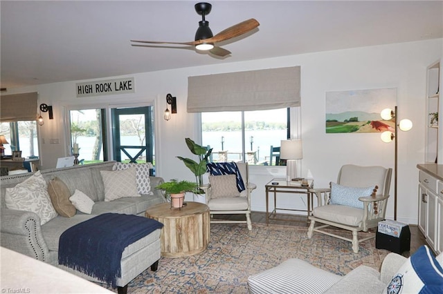 living area featuring ceiling fan