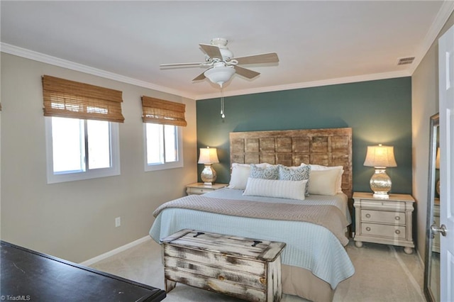 carpeted bedroom featuring baseboards, ornamental molding, visible vents, and ceiling fan