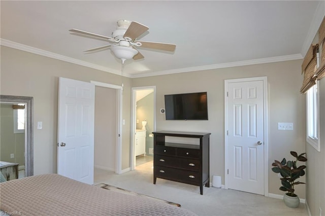bedroom with ornamental molding, baseboards, carpet floors, ceiling fan, and ensuite bathroom