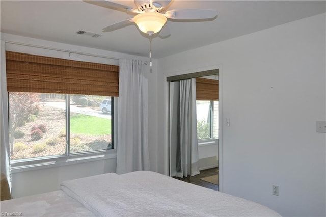 bedroom featuring ceiling fan and visible vents