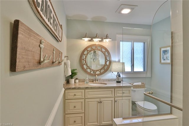 bathroom with toilet and vanity
