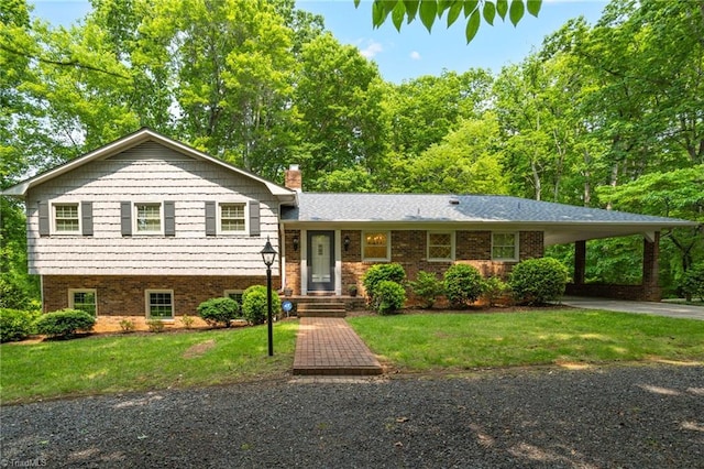 2665 Kecoughtan Rd, Pfafftown, NC 27040 - tri-level home with a front yard, a chimney, driveway, and a carport