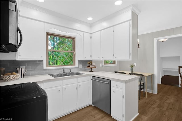 2665 Kecoughtan Rd, Pfafftown, NC 27040 - kitchen with black appliances, crown molding, a sink, plenty of natural light, and white cabinetry