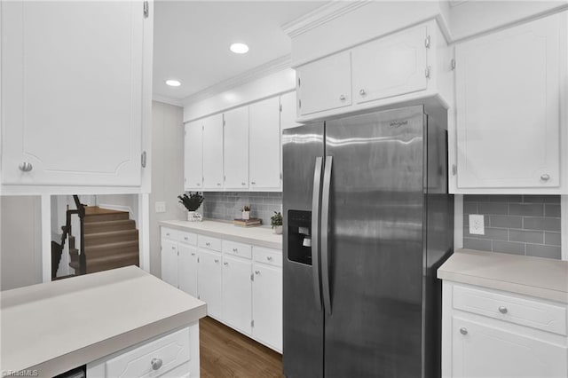 2665 Kecoughtan Rd, Pfafftown, NC 27040 - kitchen featuring stainless steel refrigerator with ice dispenser, light countertops, white cabinets, crown molding, and recessed lighting