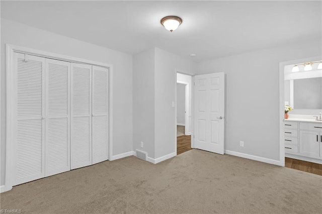2665 Kecoughtan Rd, Pfafftown, NC 27040 - unfurnished bedroom with carpet, baseboards, a closet, and connected bathroom
