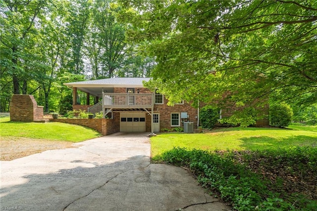 2665 Kecoughtan Rd, Pfafftown, NC 27040 - view of front of property with central AC, driveway, a garage, and a front yard