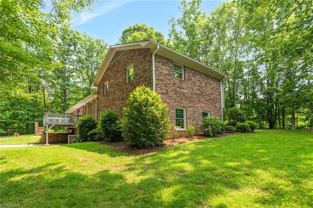 2665 Kecoughtan Rd, Pfafftown, NC 27040 - view of home's exterior with a yard, a wooden deck, and brick siding